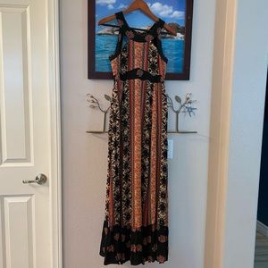 Free people size 0 maxi dress with lace up back and cutouts.